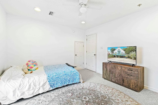 bedroom featuring ceiling fan and light colored carpet