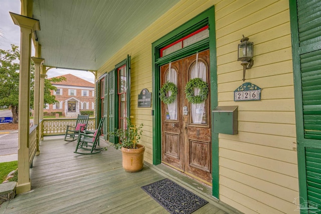 doorway to property featuring a porch