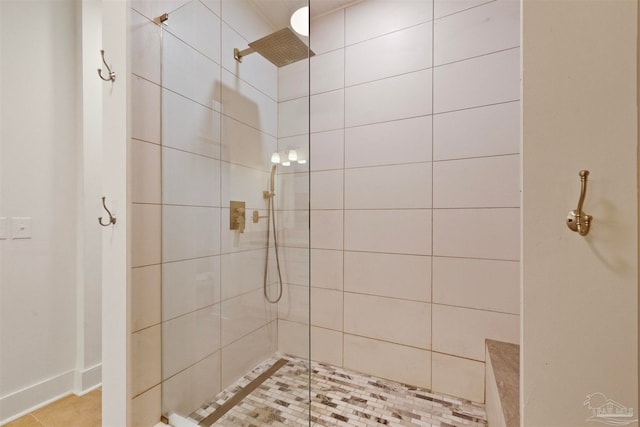 bathroom with a tile shower