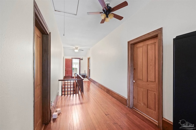 hall with wood-type flooring