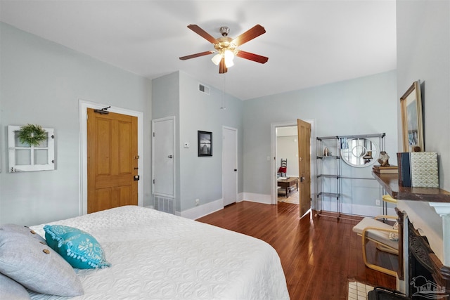 bedroom featuring ceiling fan and dark hardwood / wood-style floors