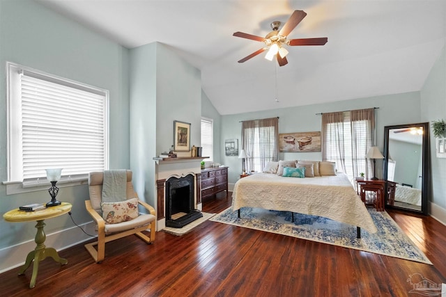 bedroom featuring vaulted ceiling, hardwood / wood-style floors, and ceiling fan