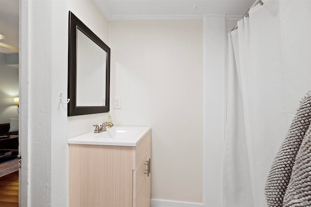 bathroom featuring vanity and crown molding