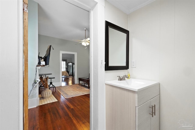 bathroom featuring ceiling fan, vanity, and hardwood / wood-style floors