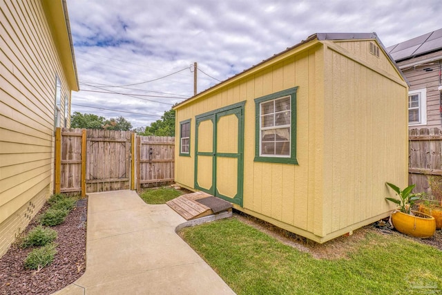 view of outbuilding with a yard