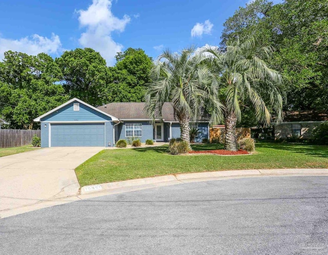 ranch-style house with fence, concrete driveway, a front yard, and a garage