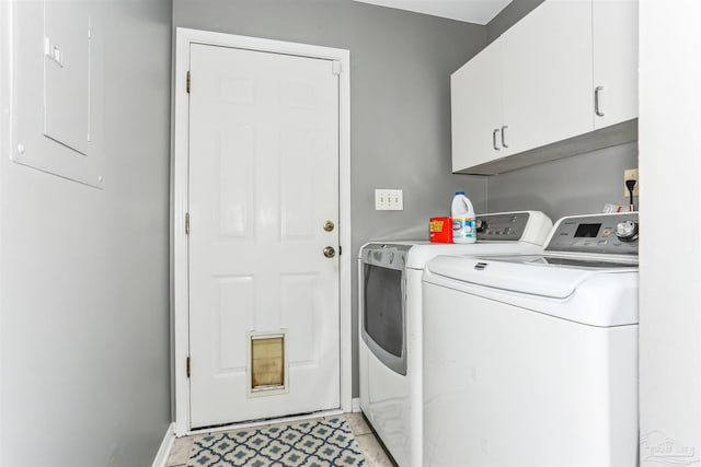 clothes washing area with washing machine and dryer, baseboards, cabinet space, and light tile patterned floors