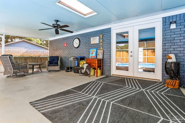 view of patio / terrace with french doors, ceiling fan, and fence