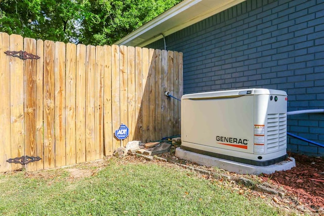 exterior details featuring brick siding and a power unit