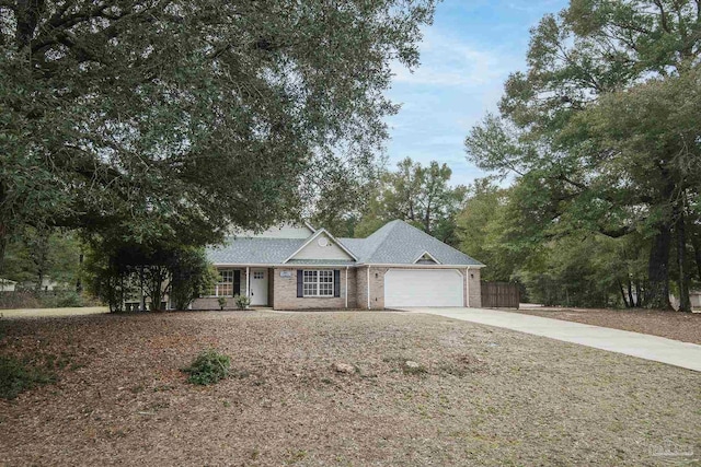 ranch-style home featuring a garage