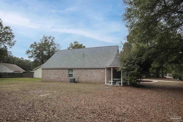 back of house featuring central AC