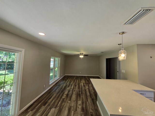 kitchen with white cabinets, decorative backsplash, dark hardwood / wood-style floors, and stainless steel appliances