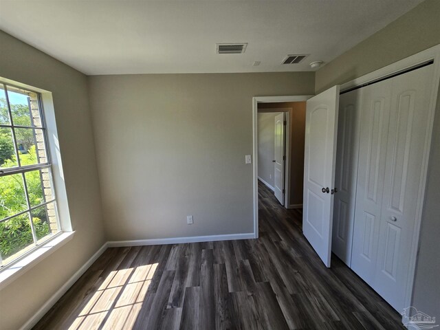 corridor with dark wood-type flooring