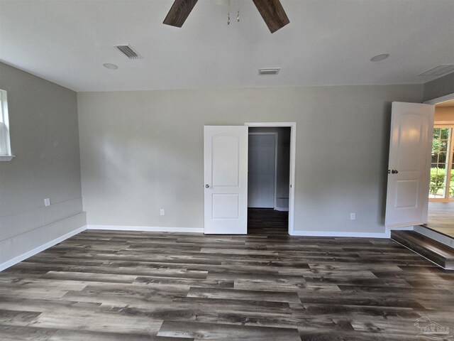 empty room featuring wood-type flooring and ceiling fan