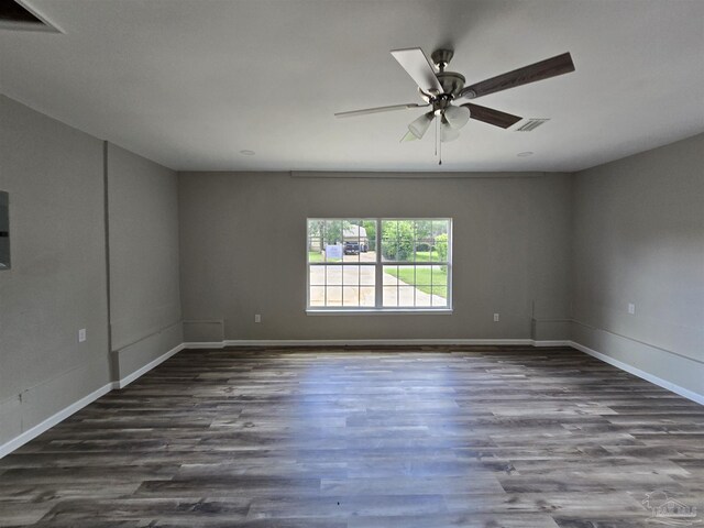 spare room featuring wood-type flooring and ceiling fan