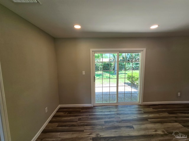 empty room with dark wood-type flooring