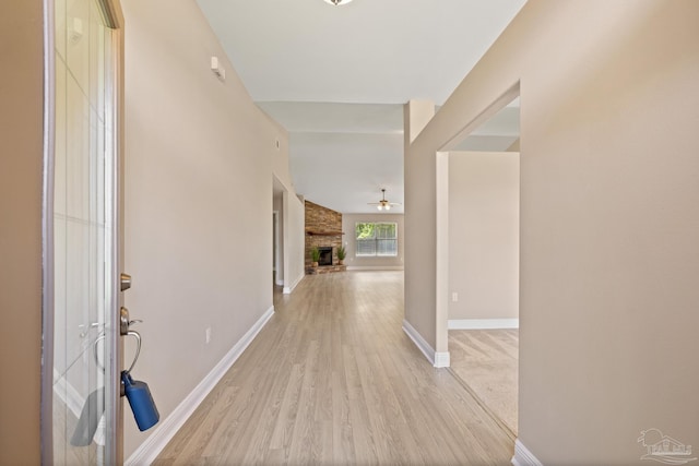 1804 Twin Pine Blvd, Gulf Breeze, FL 32563 - entrance foyer with light wood finished floors, ceiling fan, and a fireplace