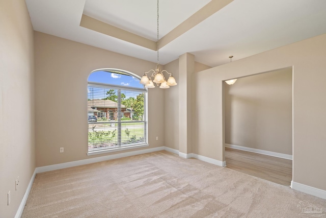 1804 Twin Pine Blvd, Gulf Breeze, FL 32563 - spare room featuring carpet, a chandelier, and a tray ceiling