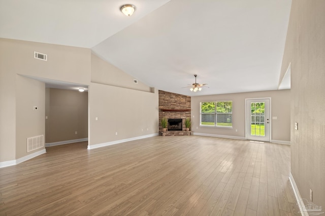 1804 Twin Pine Blvd, Gulf Breeze, FL 32563 - unfurnished living room with ceiling fan, vaulted ceiling, light wood-style flooring, and a stone fireplace