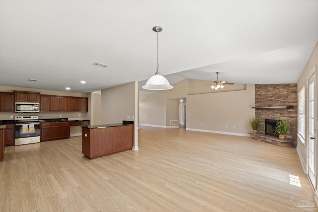 1804 Twin Pine Blvd, Gulf Breeze, FL 32563 - kitchen with appliances with stainless steel finishes, dark countertops, a ceiling fan, light wood-style flooring, and recessed lighting