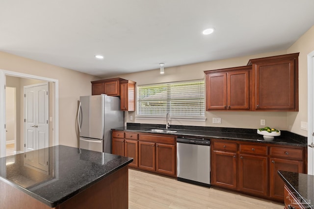 1804 Twin Pine Blvd, Gulf Breeze, FL 32563 - kitchen featuring stainless steel appliances, light wood-style floors, dark stone counters, recessed lighting, and a kitchen island