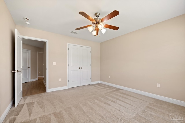 1804 Twin Pine Blvd, Gulf Breeze, FL 32563 - unfurnished bedroom with light colored carpet, a closet, and a ceiling fan
