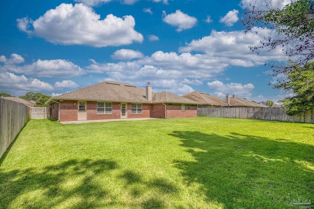 1804 Twin Pine Blvd, Gulf Breeze, FL 32563 - rear view of property with brick siding, a fenced backyard, and a chimney