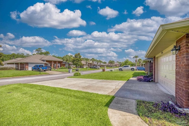 1804 Twin Pine Blvd, Gulf Breeze, FL 32563 - view of green lawn featuring asphalt driveway and a residential view