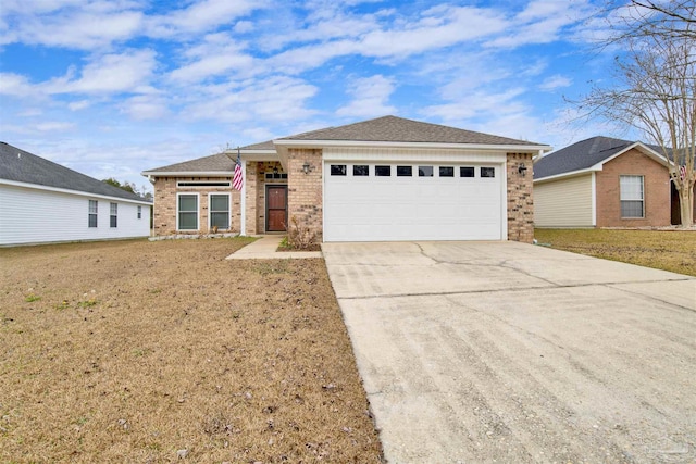 view of front of house with a garage and a front lawn