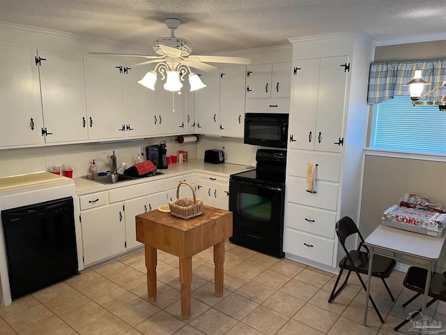 kitchen with white cabinetry, ceiling fan, crown molding, light tile patterned floors, and black appliances