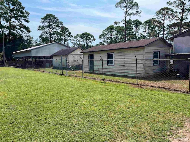 exterior space with a lawn and an outdoor structure