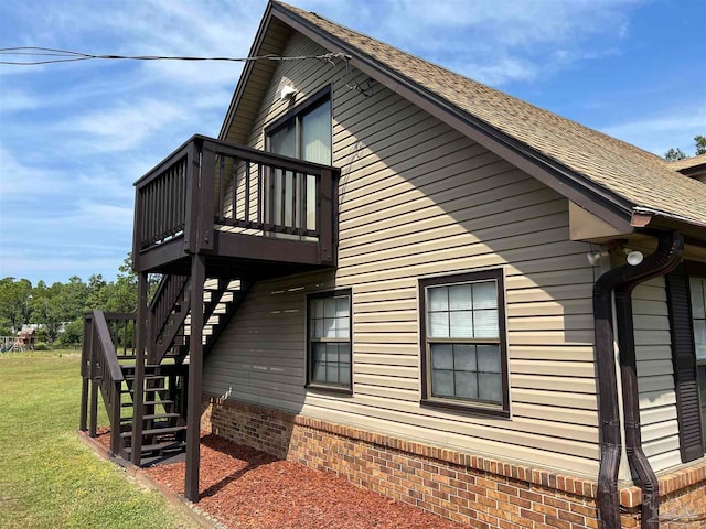 view of side of property with a balcony