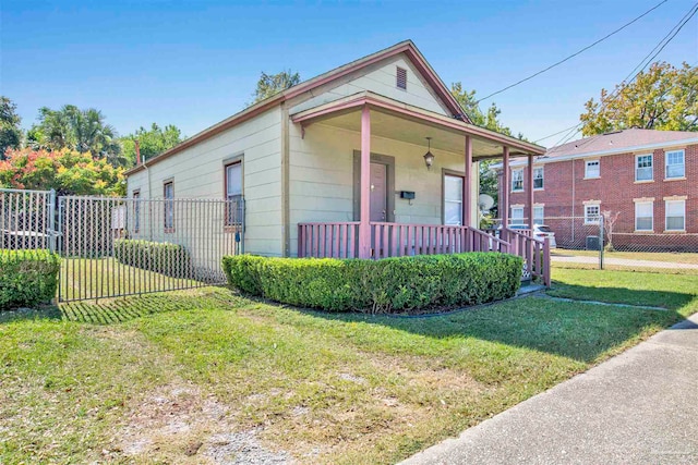 view of front of property with a front yard and a porch