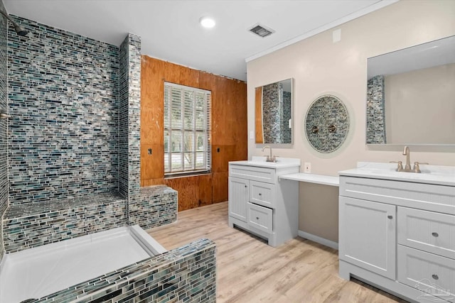 bathroom with vanity, wood-type flooring, and walk in shower