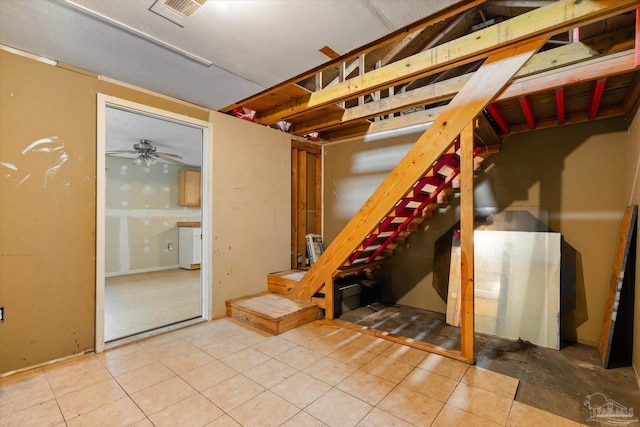 basement featuring ceiling fan