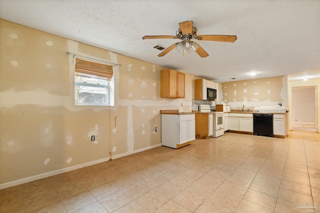 kitchen featuring black appliances, sink, ceiling fan, light tile patterned floors, and a textured ceiling