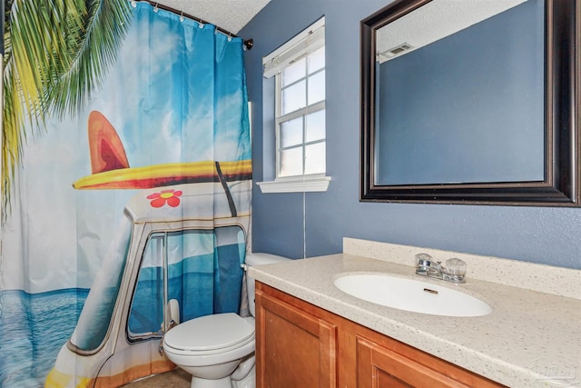 bathroom with vanity, toilet, a textured ceiling, and a shower with shower curtain