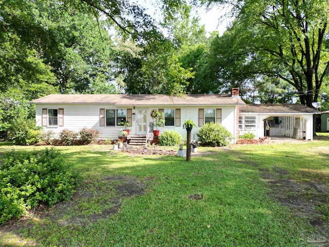 7231 Ridge Rd, Brewton, AL 36426 - single story home with a chimney, a front yard, and an attached carport