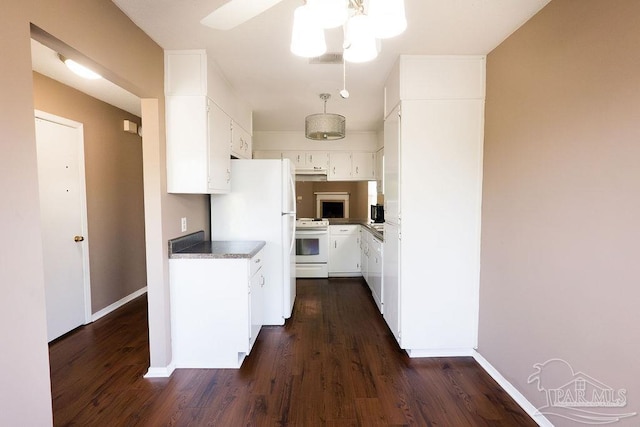 kitchen with white appliances, ceiling fan, dark wood-type flooring, and white cabinets