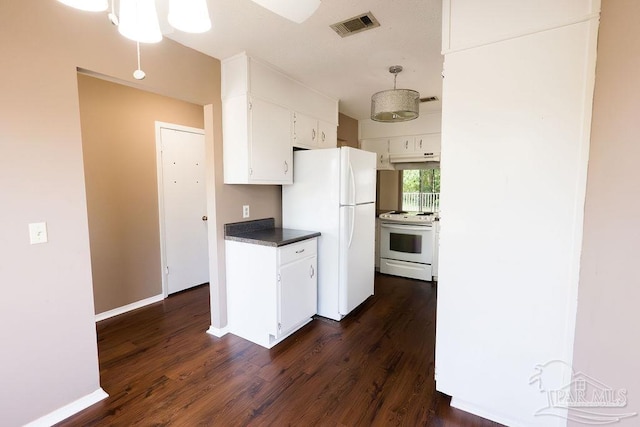 kitchen with dark hardwood / wood-style flooring, white appliances, and white cabinets