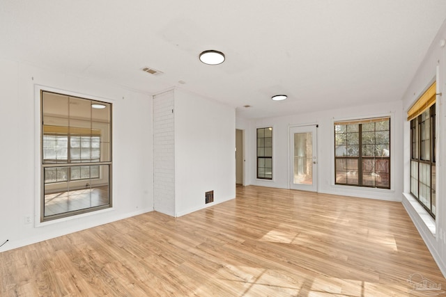 spare room with light hardwood / wood-style floors