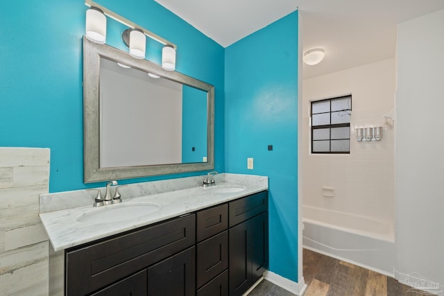 bathroom featuring hardwood / wood-style flooring and vanity