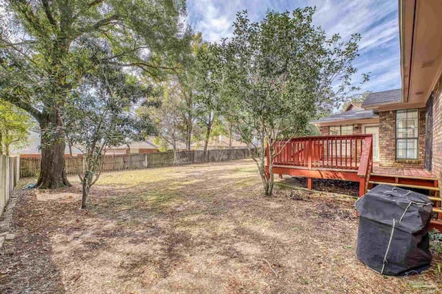 view of yard featuring a wooden deck