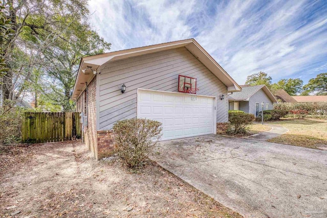 view of side of home with a garage