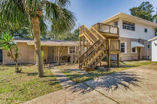 view of front of property with stairs