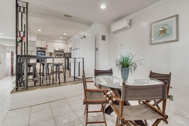 dining space with light tile patterned floors, a wall mounted AC, visible vents, and recessed lighting