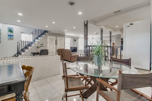 dining area with stairway, light tile patterned flooring, visible vents, and recessed lighting