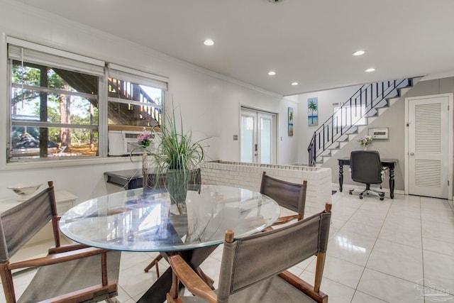 dining area with light tile patterned floors, cooling unit, stairs, french doors, and crown molding