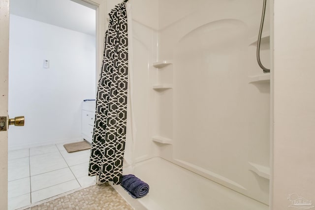 bathroom with tile patterned flooring and a shower with shower curtain