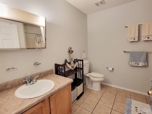 full bath with a textured ceiling, vanity, tile patterned flooring, visible vents, and toilet